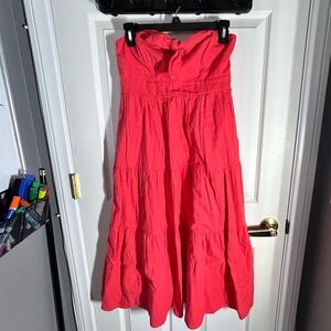 Bright pink/ coral strapless dress.
